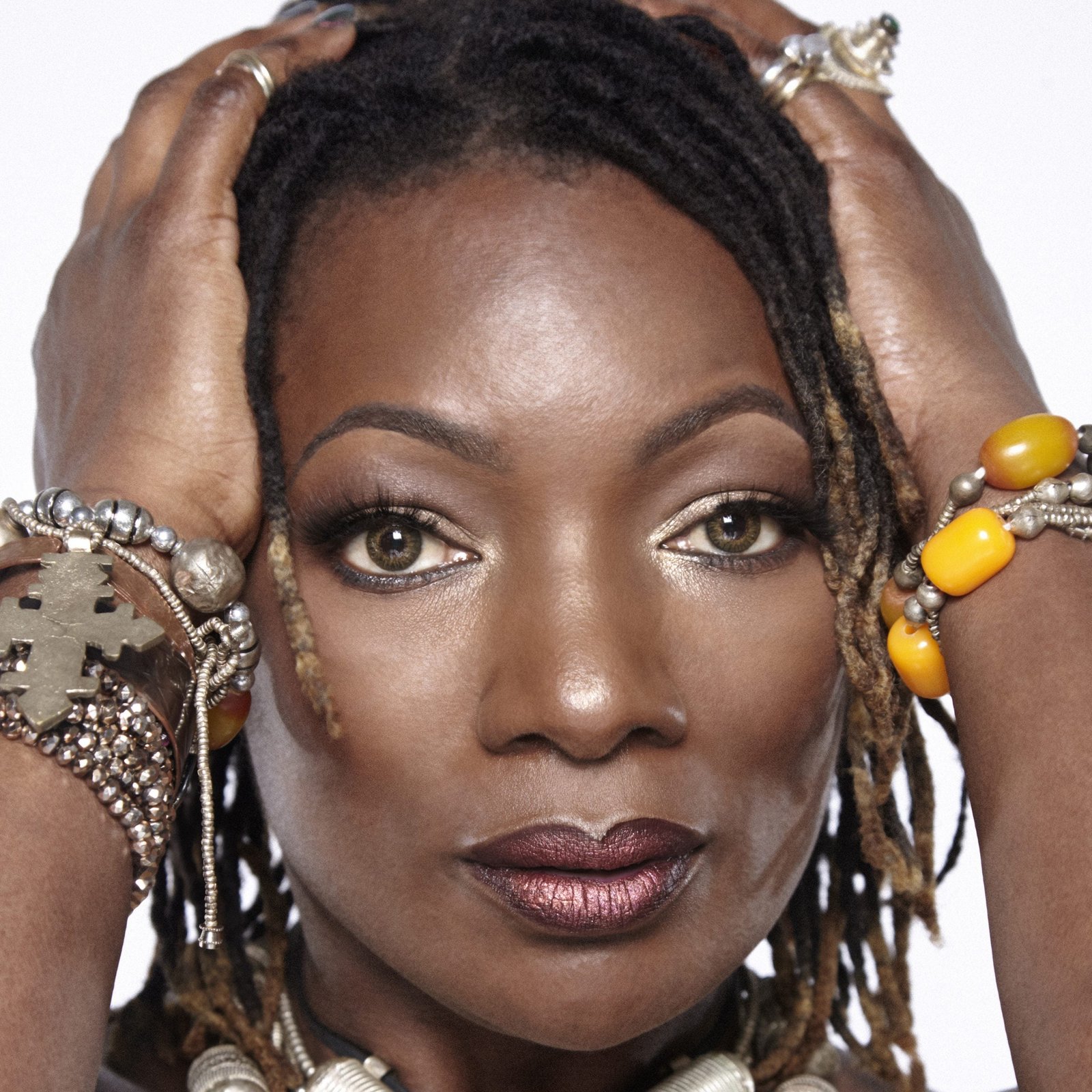 Close-up of Luvain's face against a white backdrop.