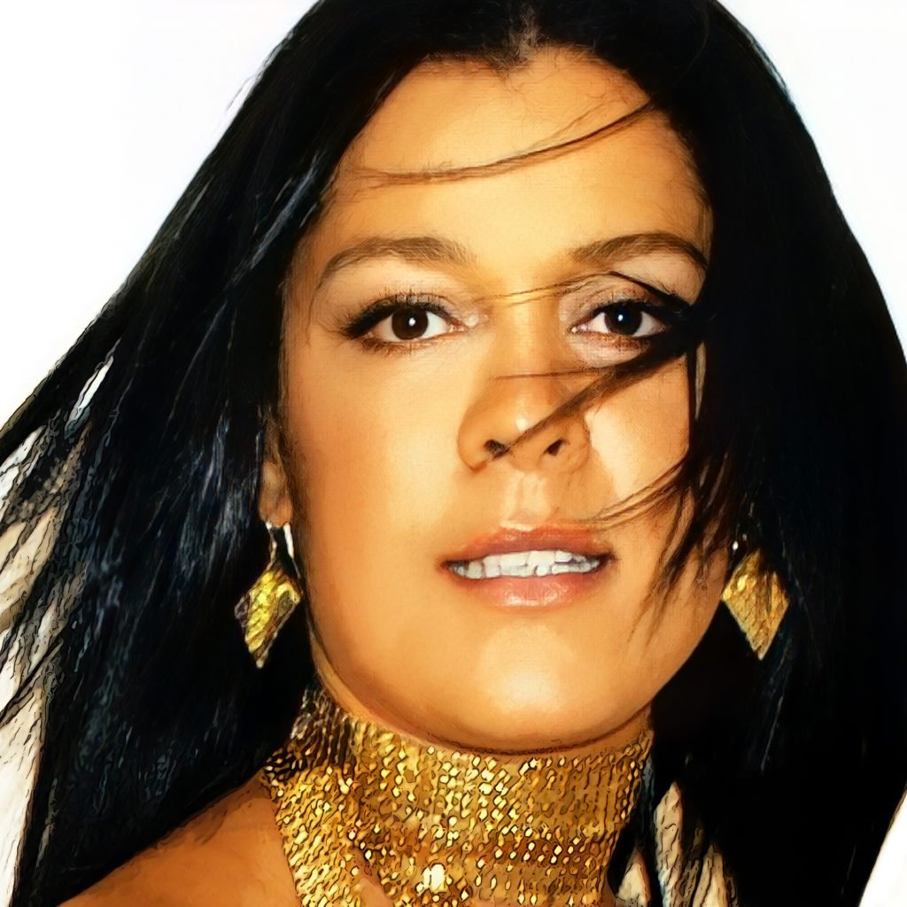 A close up of Shanie with swept hair, in motion as though dancing.